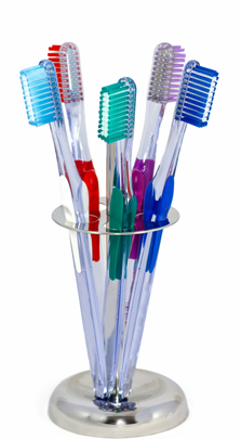 Photo of toothbrushes standing in glass